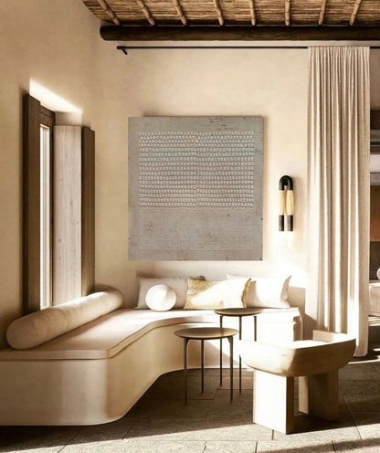 Wabi-Sabi wall art creating peaceful atmosphere in bright interior.