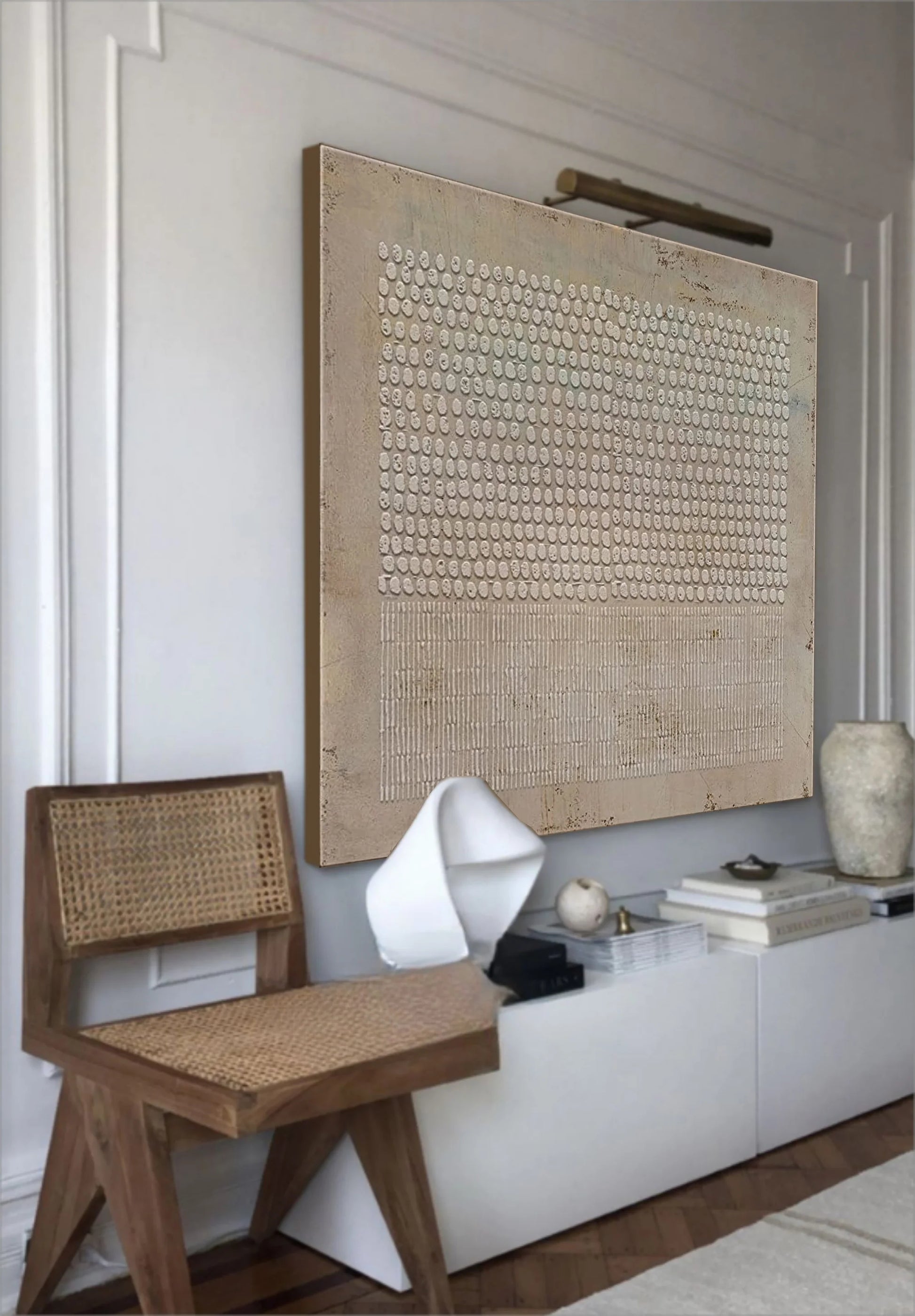 Raised pattern abstract painting displayed in minimalistic room.