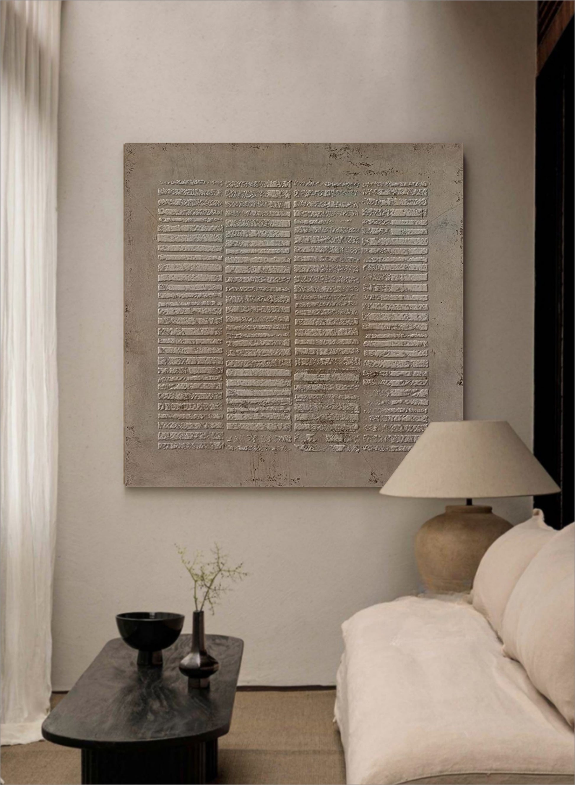 Neutral abstract wall art above sofa in cozy living room setting